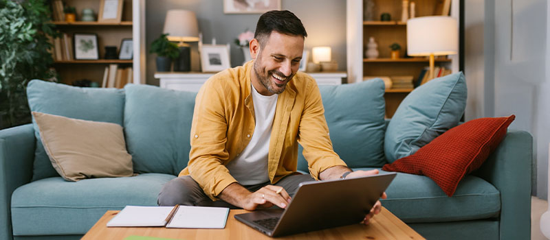 Smiling man working from home