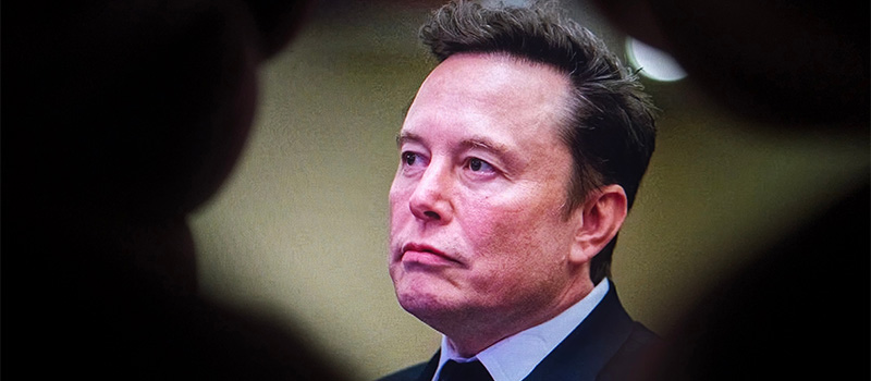 Elon Musk in suit portrait closeup