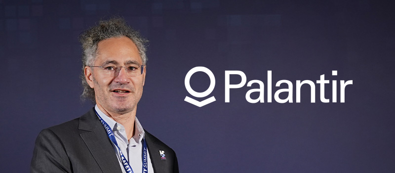 Palantir CEO Alex Karp with company logo