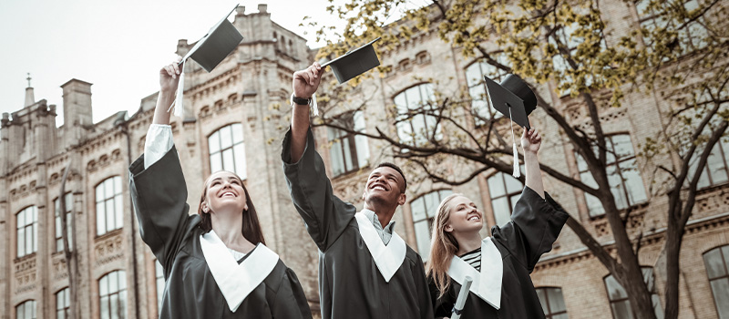 Happy graduates celebrating graduation day