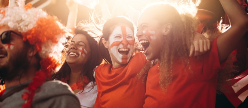 Happy football fans celebrating match