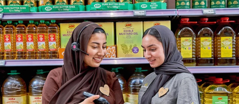 Morrisons store staff assisting customers