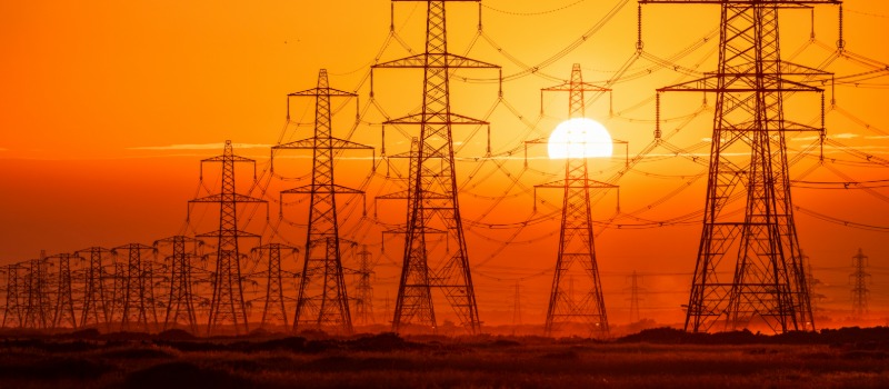Power lines at sunset silhouette