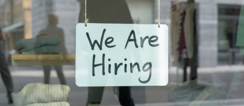 Hiring sign on store window