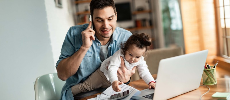Father working from home multitasking