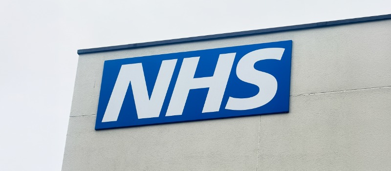 NHS logo on building exterior