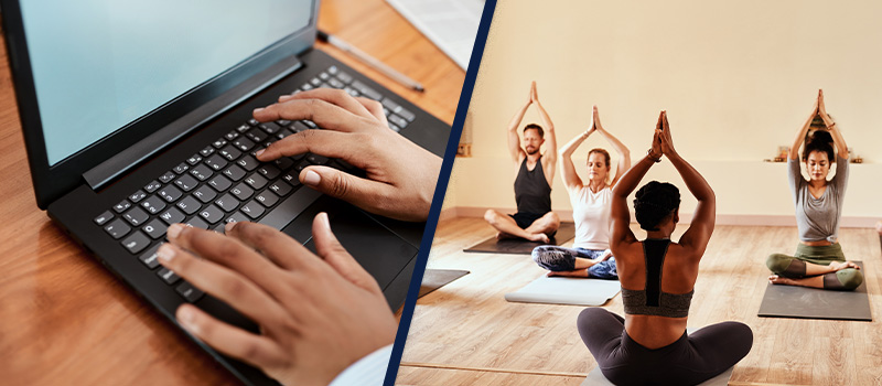 Typing on laptop, group yoga class