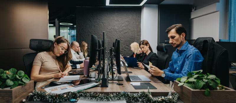 Modern office employees working computers