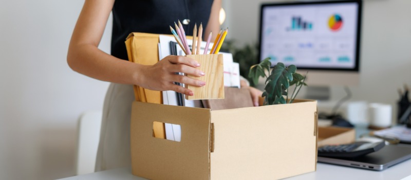 Office employee packing personal belongings