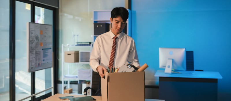Office worker packing personal belongings