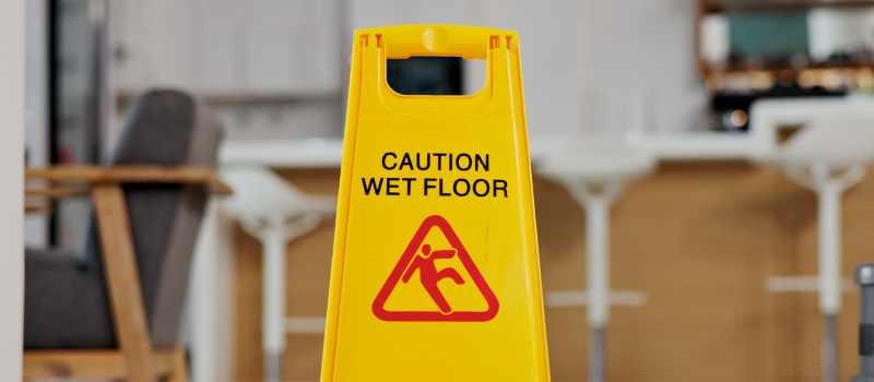 Yellow caution wet floor sign