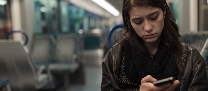 Sad woman alone on train