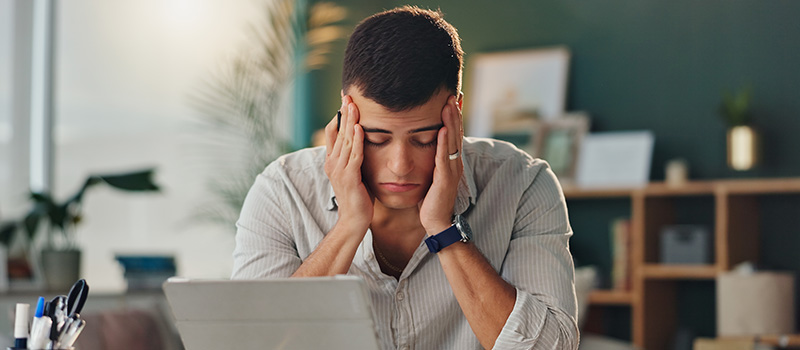 Stressed man working at desk