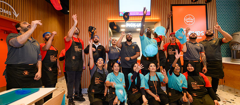 Restaurant staff celebrating team success