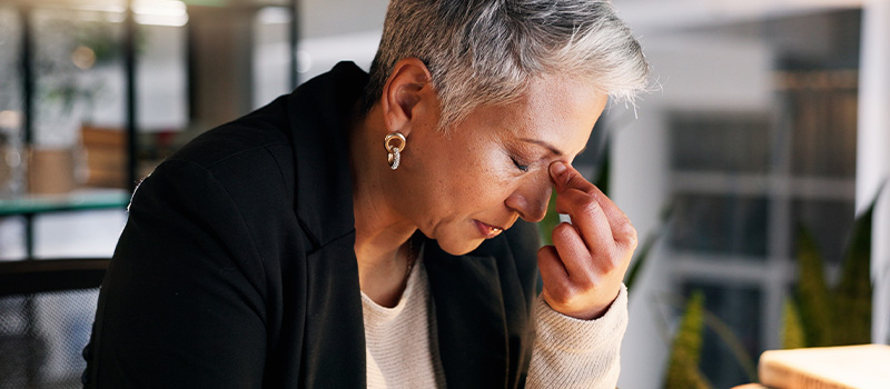 Stressed businesswoman at work desk