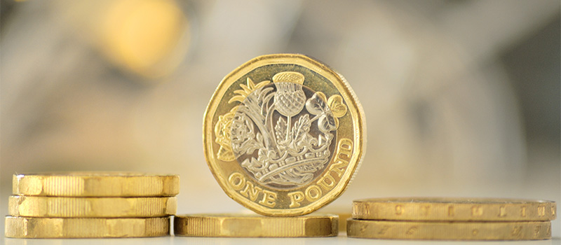 British one pound coins stacked