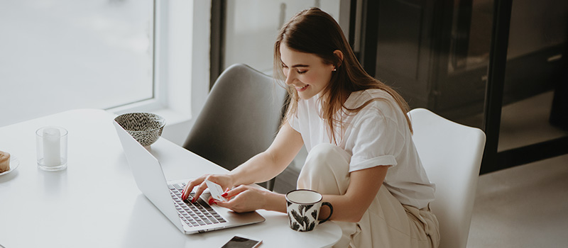 Woman working on laptop home