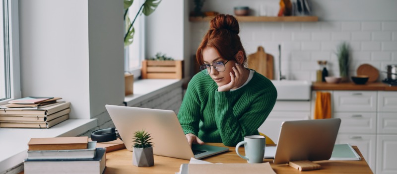 Woman working remotely with laptops