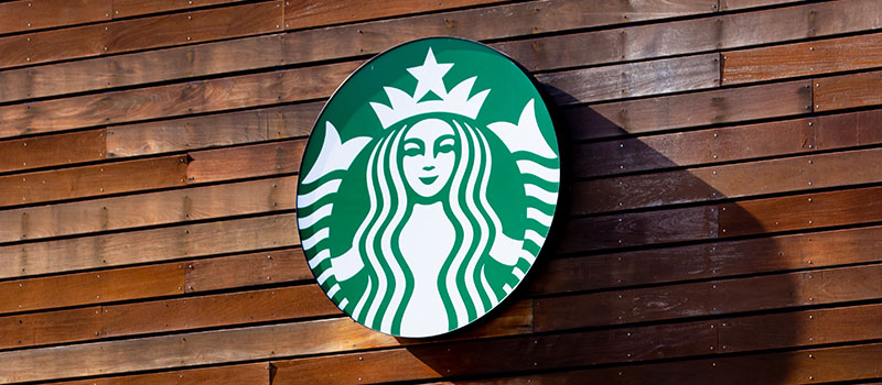 Starbucks logo on wooden wall