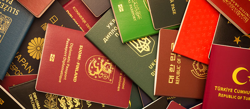 Colorful international passports collection overlapping