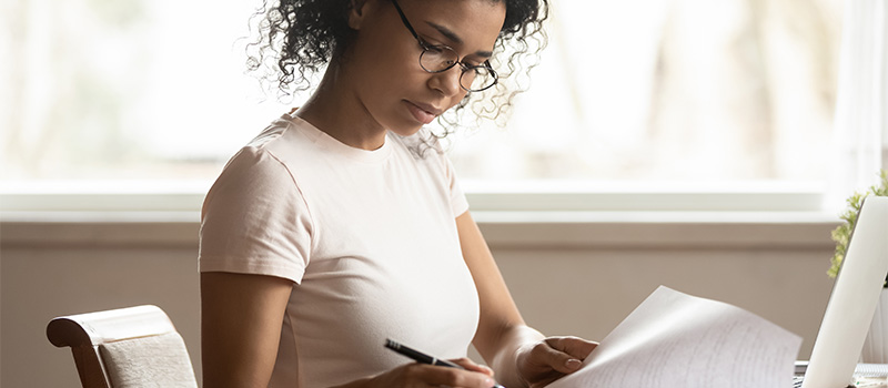 Woman studying at home desk