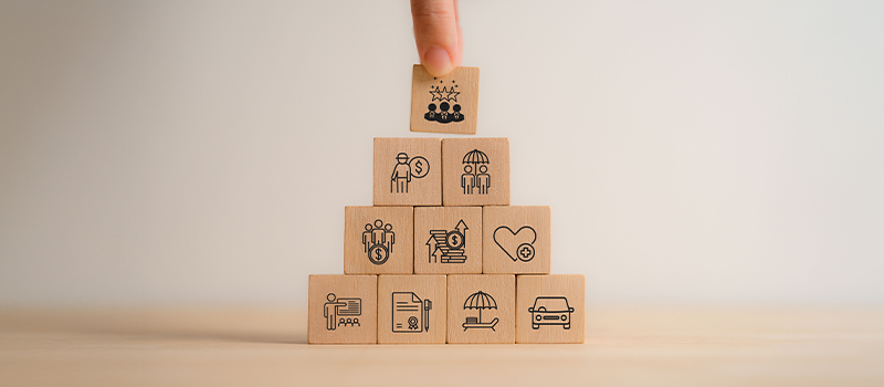 When does a work perk become a contractual right? Business success pyramid wooden blocks