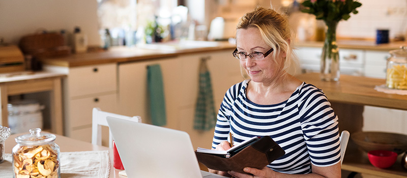 Woman working from home kitchen