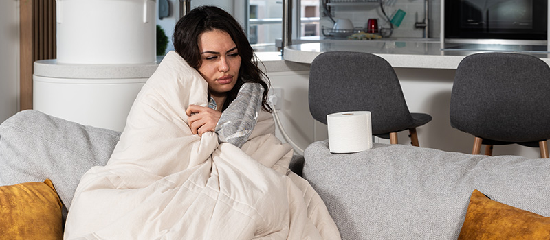 Sick woman on couch resting