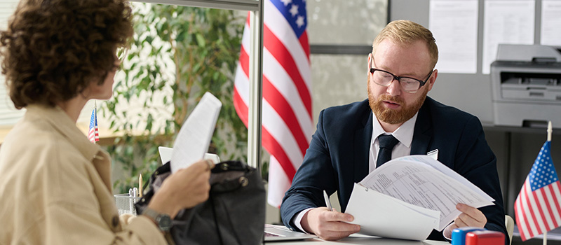 Government official reviewing documents applicant