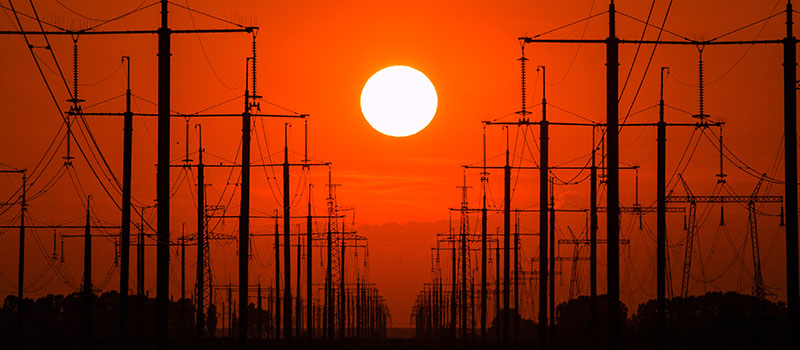Power lines at sunset silhouette