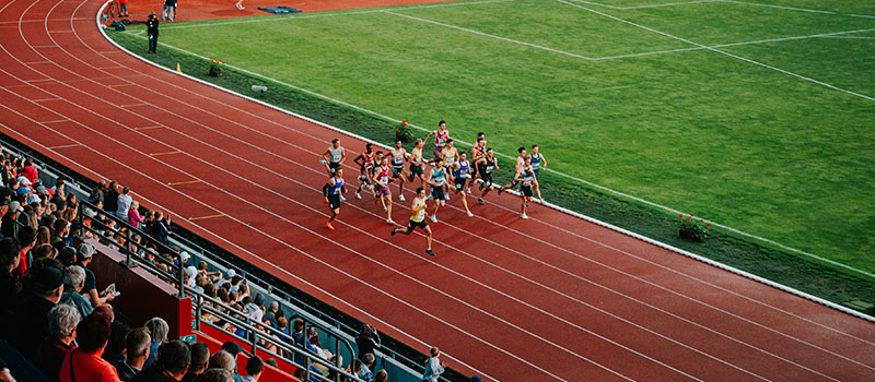 Athletes running on athletics track