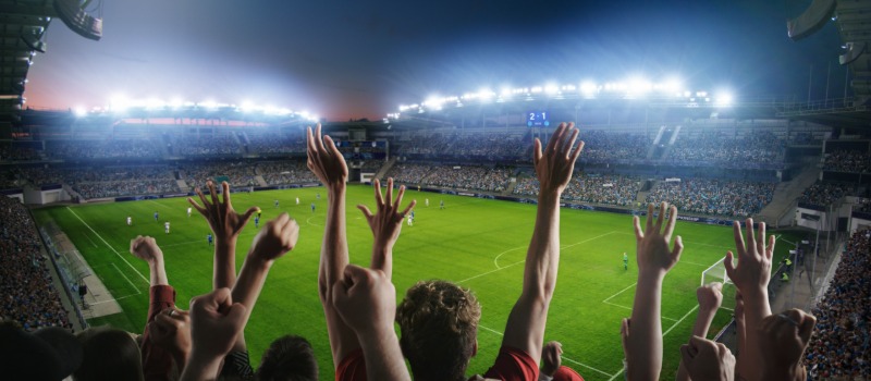 Soccer fans cheering in stadium