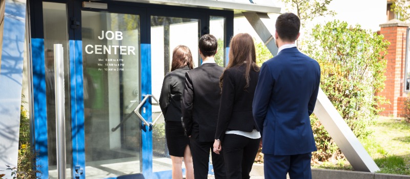 Young people standing in line at a Job Centre