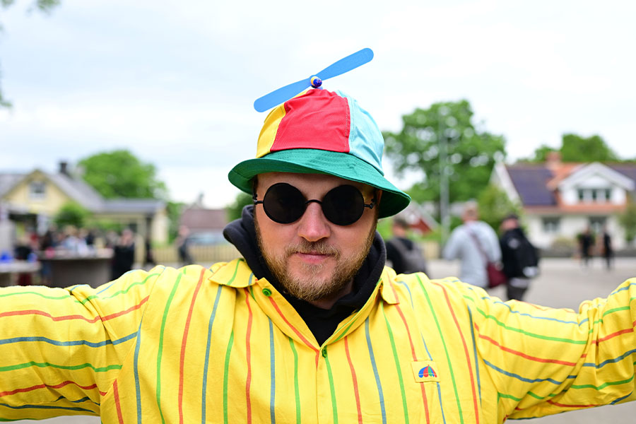 Man in colorful propeller hat
