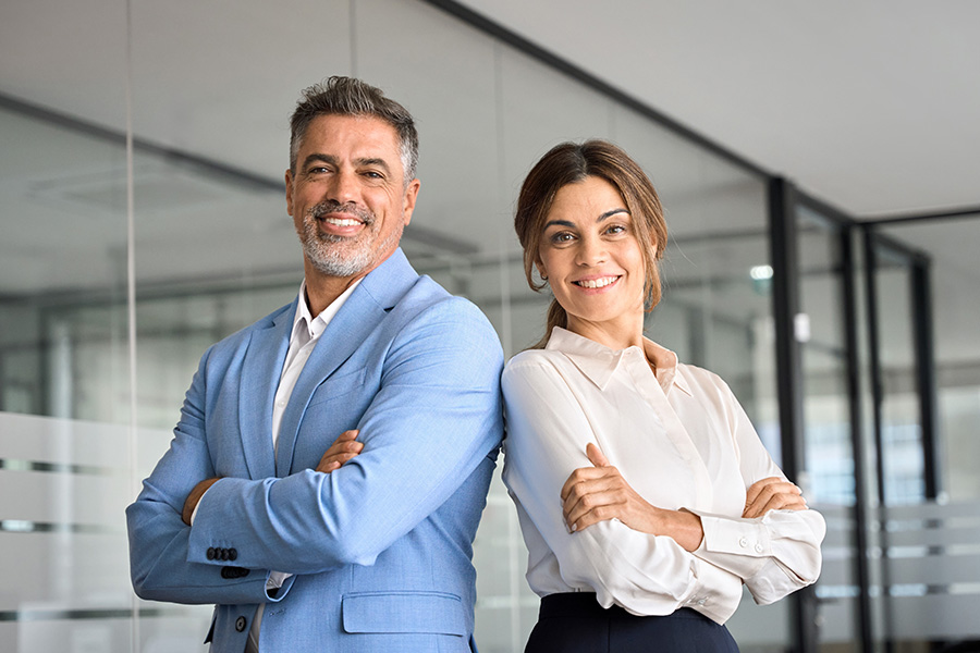 Confident business professionals smiling indoors
