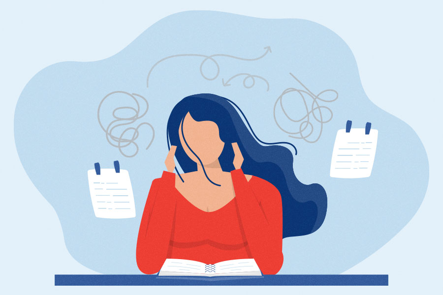 Stressed woman studying at desk