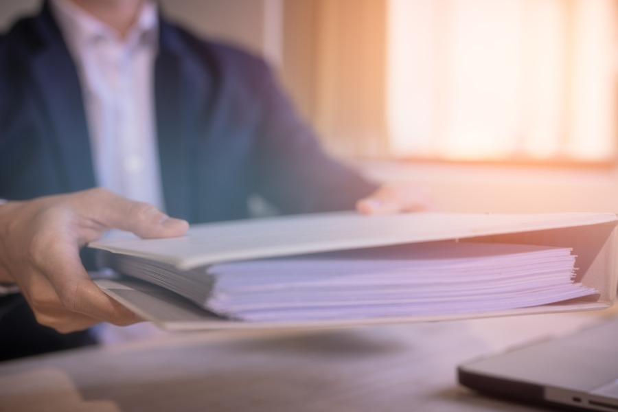 Businessman handing over documents