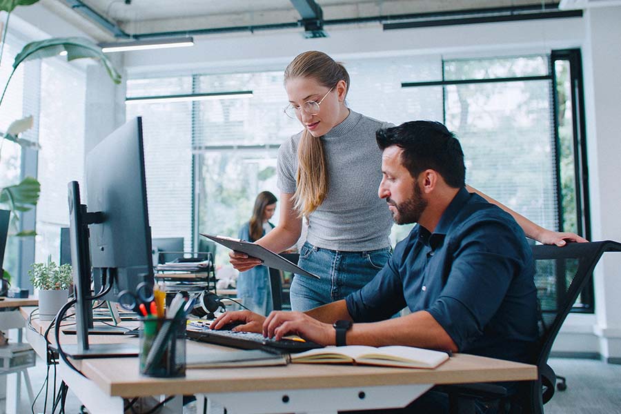 Coworkers collaborating in modern office