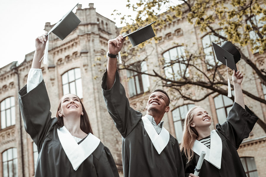 Happy graduates celebrating graduation day