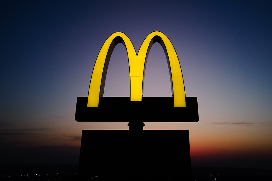 McDonald's golden arches logo at sunset