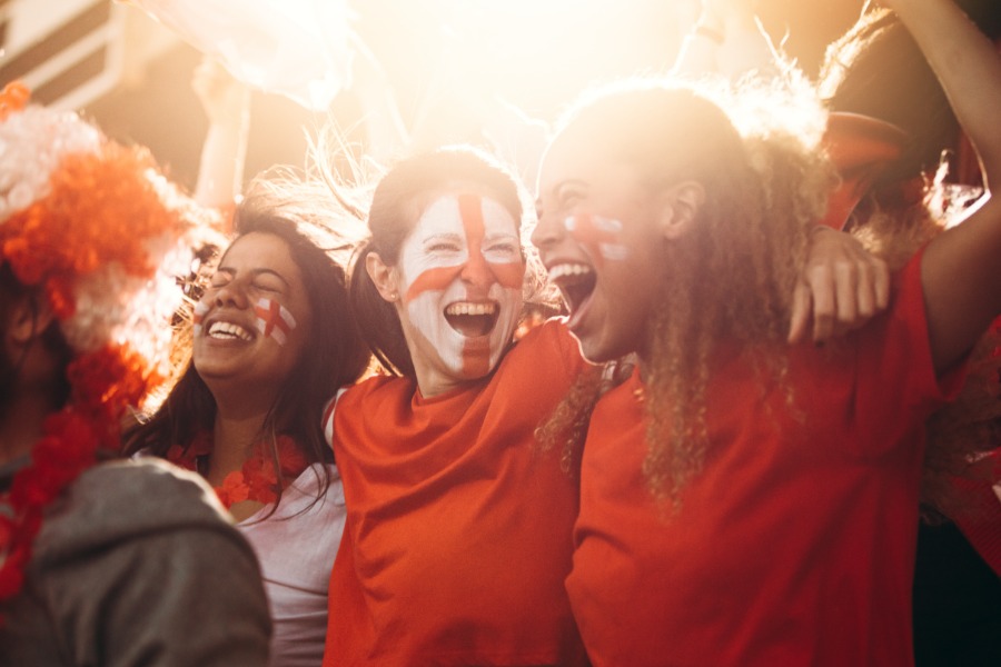 Happy football fans celebrating match