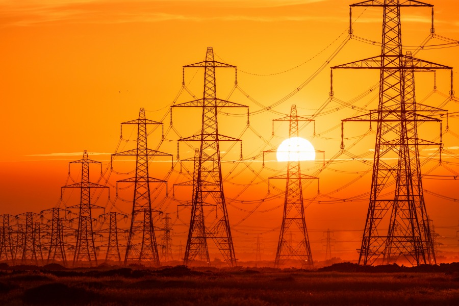 Power lines at sunset silhouette