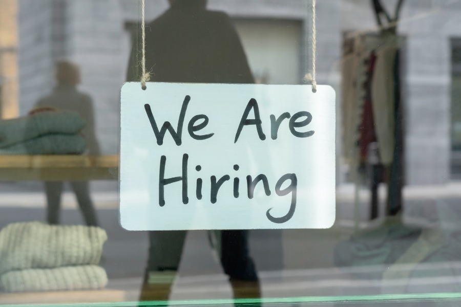Major firms unite to help care leavers and prison leavers into work Hiring sign on store window