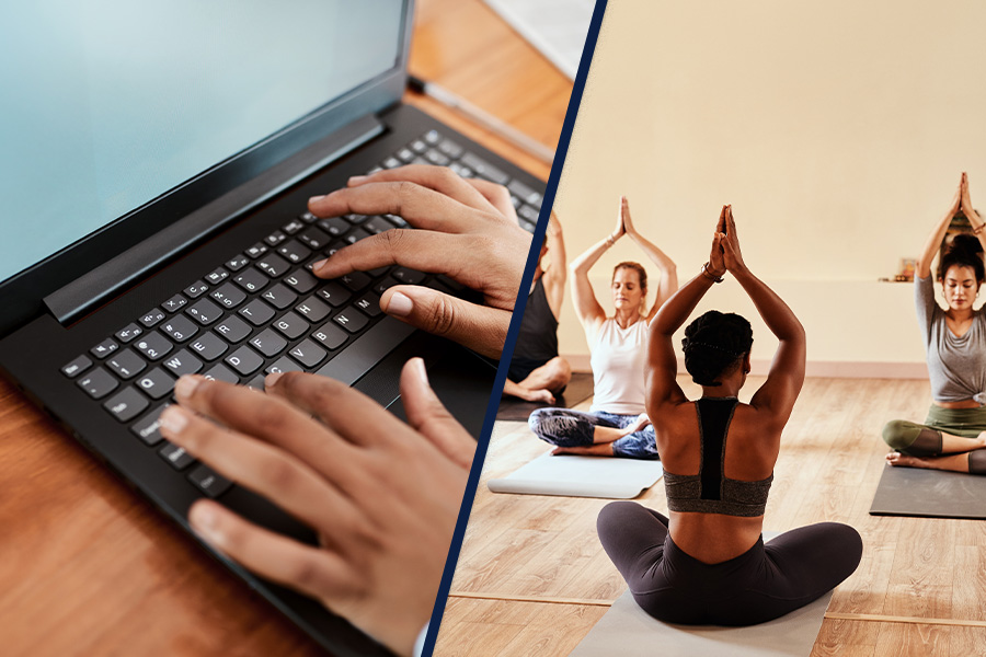 Typing on laptop, group yoga class