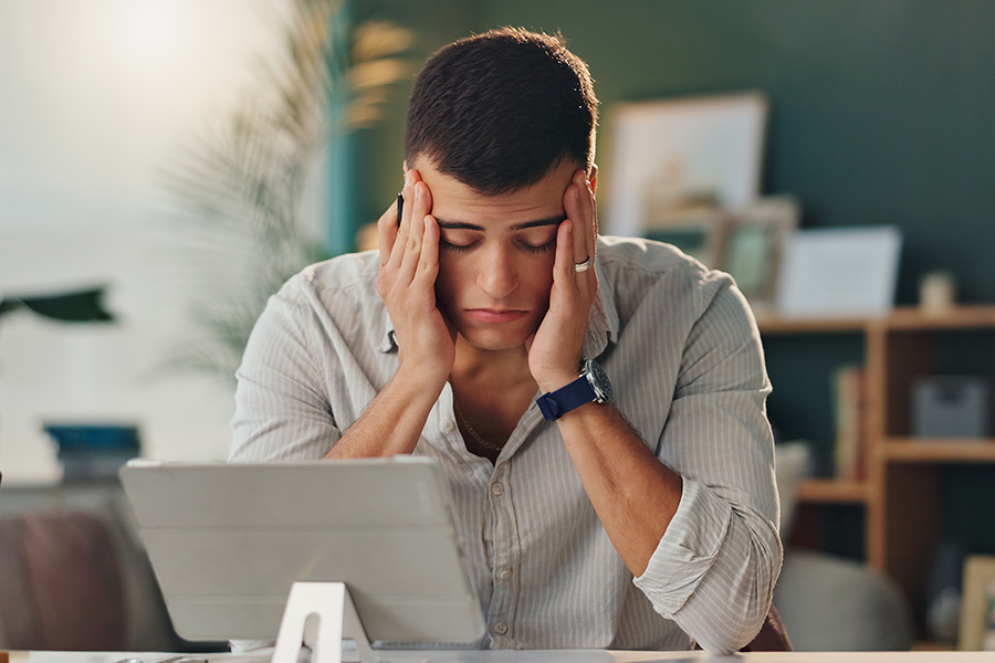 Stressed man working at desk