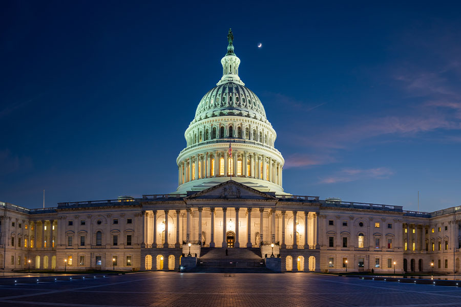 Education dept violated employee's first amendment rights with out-of-office emails, judge rules US Capitol building at night