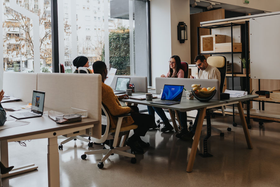 young-workers-sitting-at-desks-in-office-environment