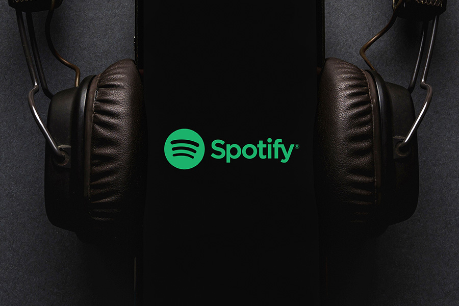 Spotify logo with headphones dark background
