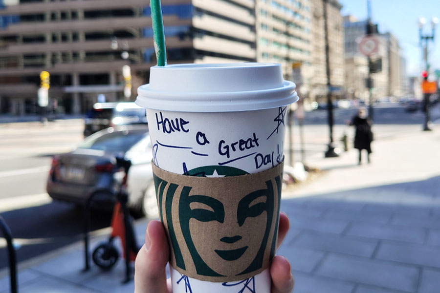 Starbucks coffee cup city street