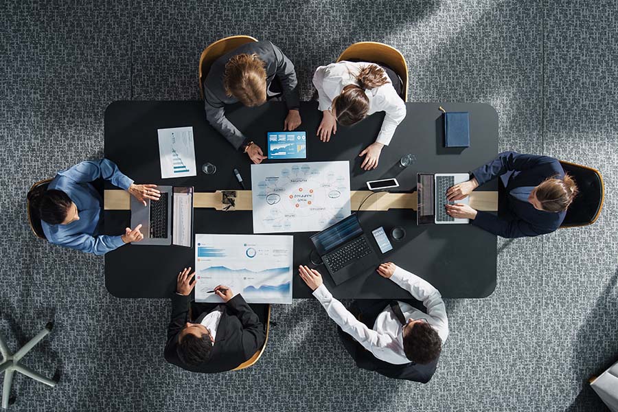 Business team meeting overhead view